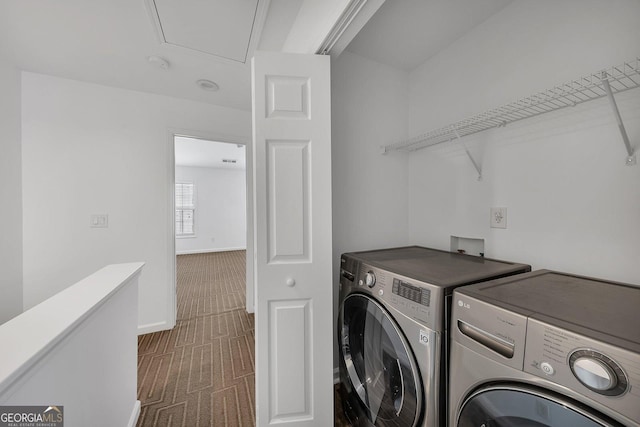 washroom featuring carpet floors, separate washer and dryer, baseboards, attic access, and laundry area