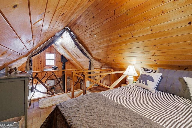 unfurnished bedroom featuring wooden walls, wood ceiling, and lofted ceiling