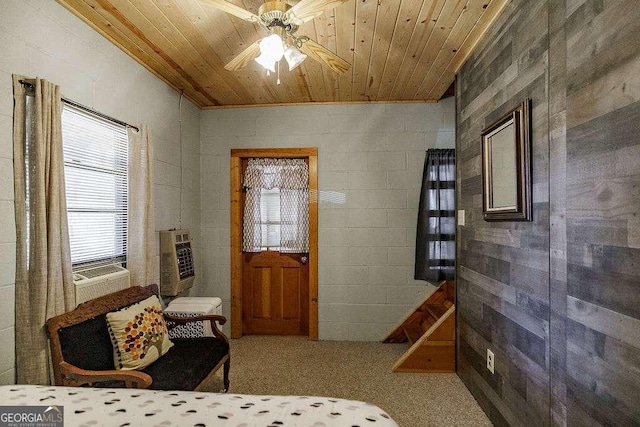 interior space with wooden ceiling and ceiling fan