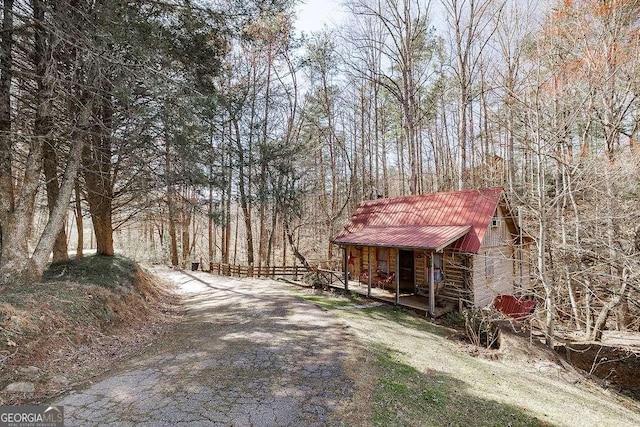 exterior space featuring a forest view