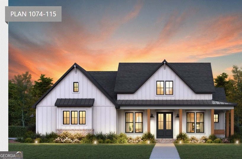 view of front facade with a standing seam roof, brick siding, a front lawn, board and batten siding, and metal roof