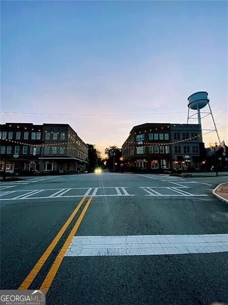 view of road featuring curbs