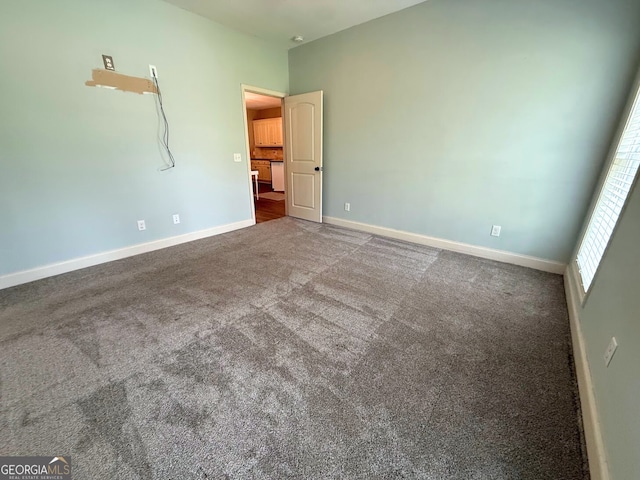 unfurnished bedroom featuring baseboards and carpet floors