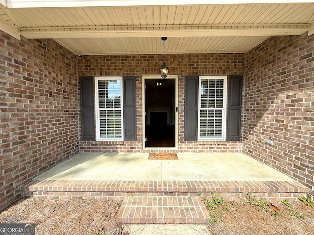 entrance to property with brick siding