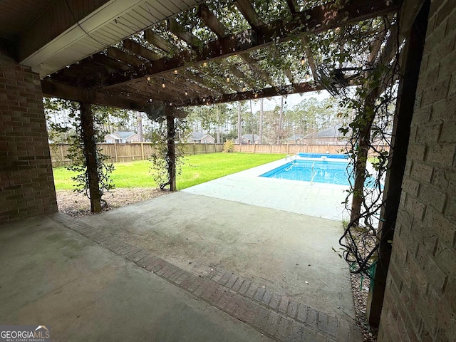 view of pool featuring a fenced in pool, a patio, a lawn, and a fenced backyard