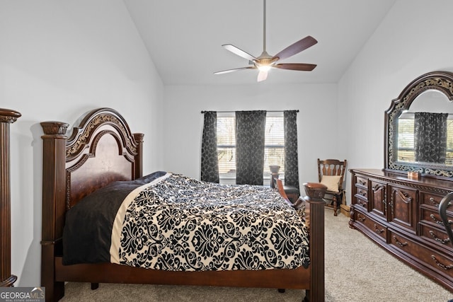 bedroom featuring carpet, a ceiling fan, and vaulted ceiling