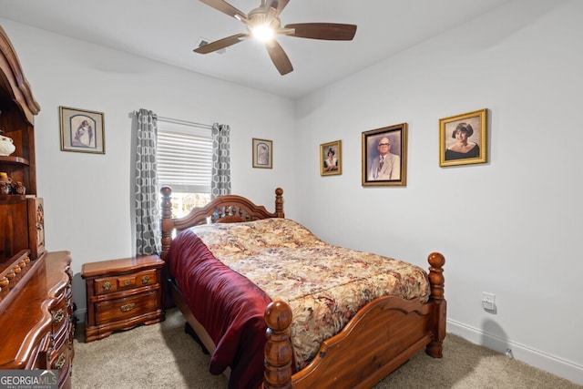 carpeted bedroom with baseboards and ceiling fan