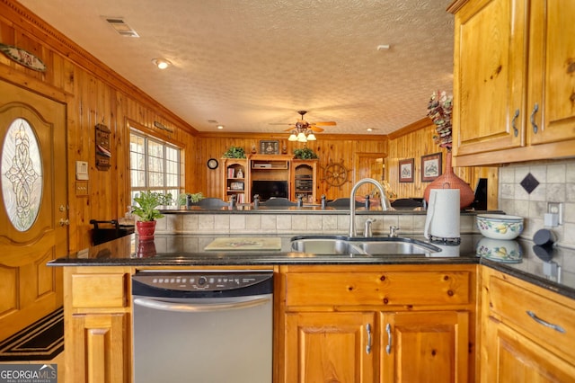 kitchen with a sink, backsplash, dishwasher, and brown cabinetry