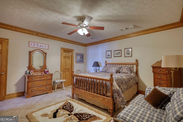 tiled bedroom featuring ceiling fan, a textured ceiling, baseboards, and ornamental molding