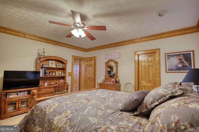 bedroom with a textured ceiling, ornamental molding, and a ceiling fan