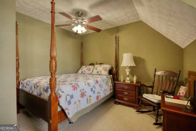 carpeted bedroom with lofted ceiling, a ceiling fan, and a textured ceiling