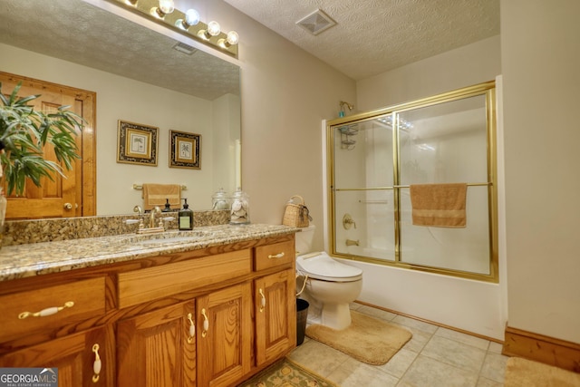 full bath featuring vanity, visible vents, enclosed tub / shower combo, a textured ceiling, and toilet