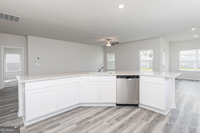 kitchen featuring light wood finished floors, visible vents, dishwasher, recessed lighting, and a sink