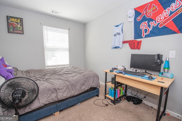 carpeted bedroom with baseboards and visible vents