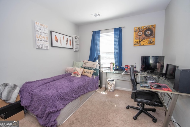 bedroom featuring visible vents, baseboards, and carpet