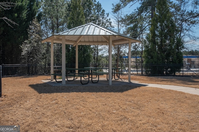 view of home's community featuring a gazebo and fence