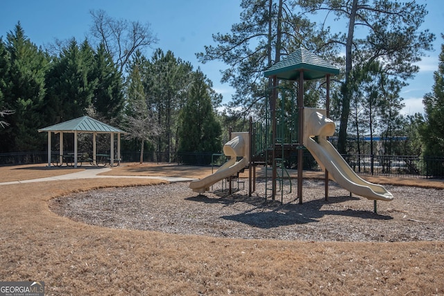 community jungle gym with a gazebo and fence