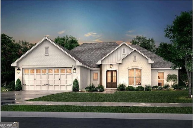 view of front of house with a garage, brick siding, concrete driveway, and a front lawn