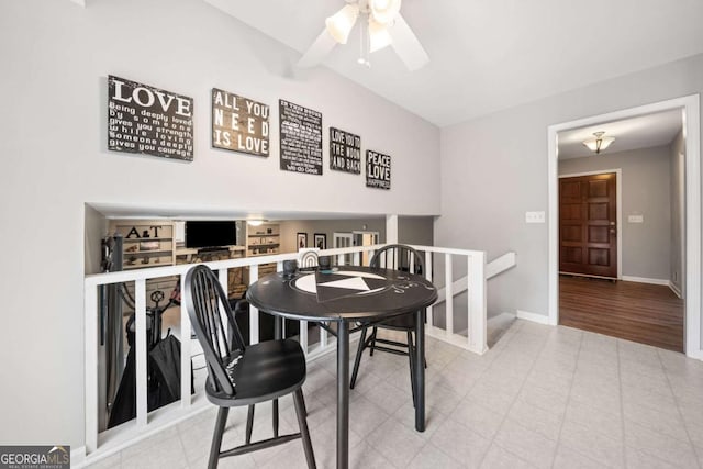 dining space with baseboards and ceiling fan