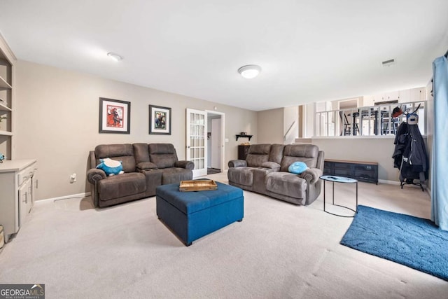 living room with stairs, baseboards, and carpet floors