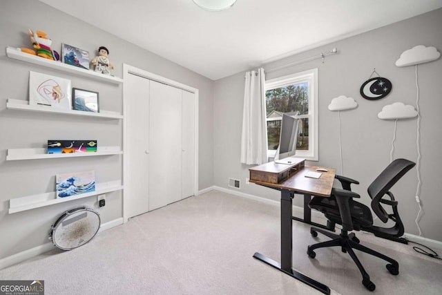 office space featuring visible vents, baseboards, and carpet