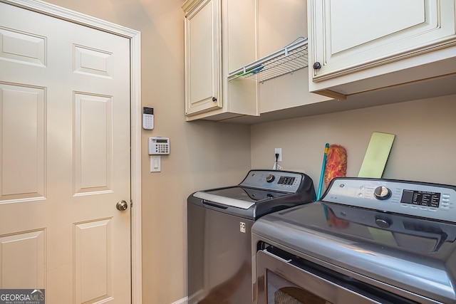 laundry area featuring cabinet space and washing machine and dryer