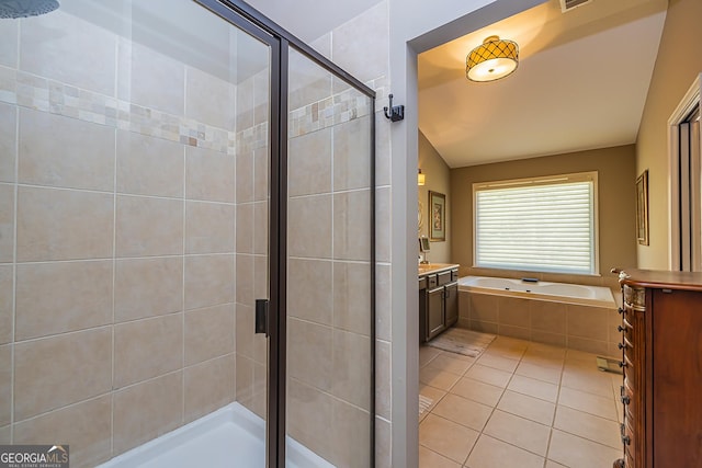 full bathroom featuring tile patterned flooring, visible vents, a garden tub, a stall shower, and vanity