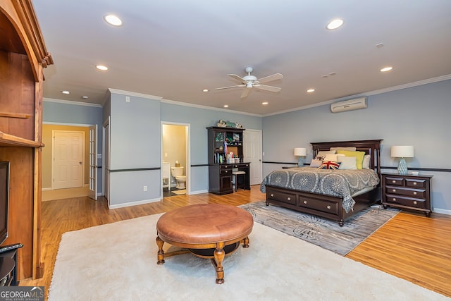 bedroom with recessed lighting, a wall mounted air conditioner, and wood finished floors