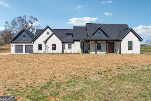 view of front of home featuring brick siding, cooling unit, and a front lawn