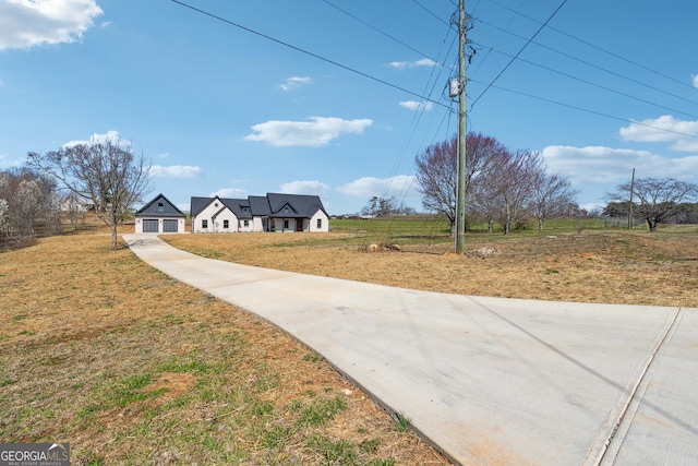 exterior space featuring concrete driveway