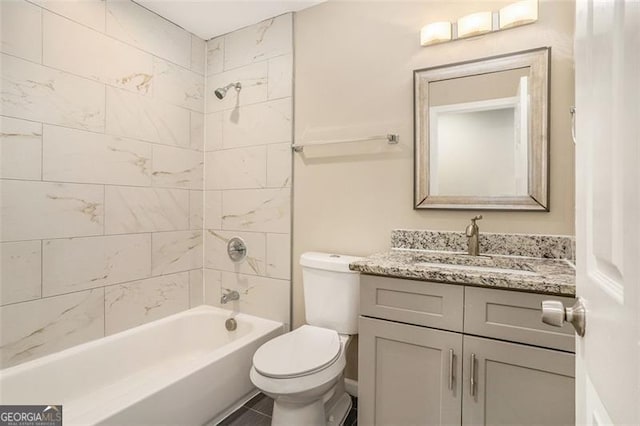 full bath featuring toilet, bathtub / shower combination, and vanity