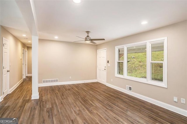 interior space with recessed lighting, visible vents, baseboards, and dark wood-type flooring