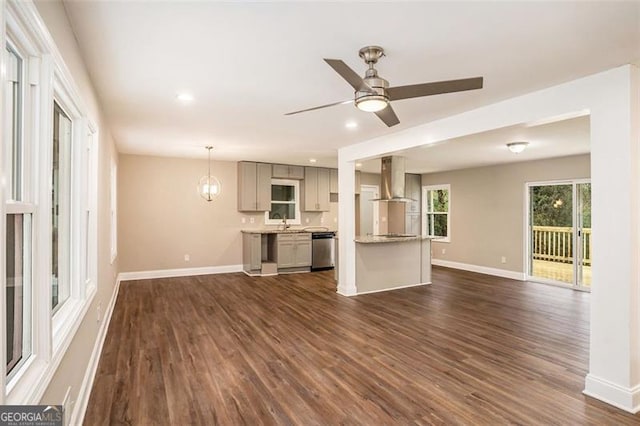 unfurnished living room with dark wood finished floors, recessed lighting, a ceiling fan, and baseboards