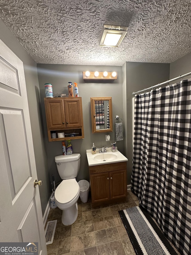 full bathroom with curtained shower, toilet, baseboards, and visible vents