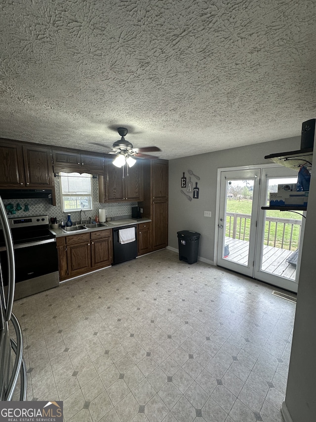 kitchen featuring stainless steel electric range oven, light floors, visible vents, a sink, and dishwasher