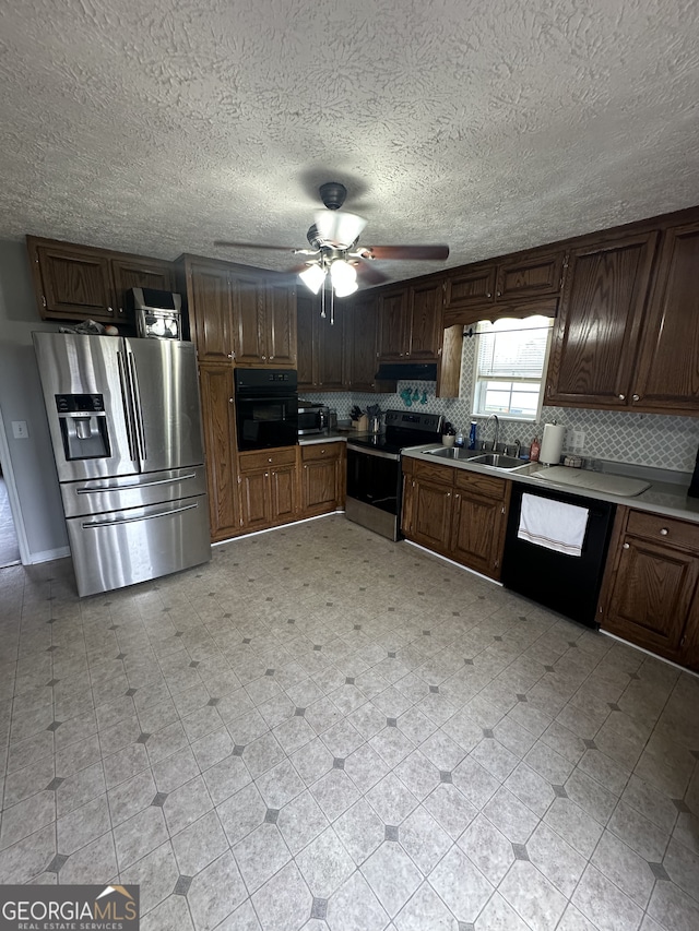 kitchen with decorative backsplash, black appliances, ceiling fan, and light countertops
