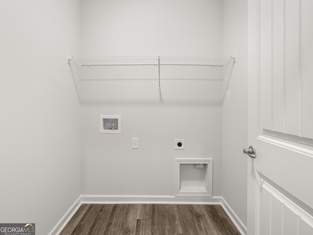 laundry area with electric dryer hookup, washer hookup, dark wood-style floors, baseboards, and laundry area