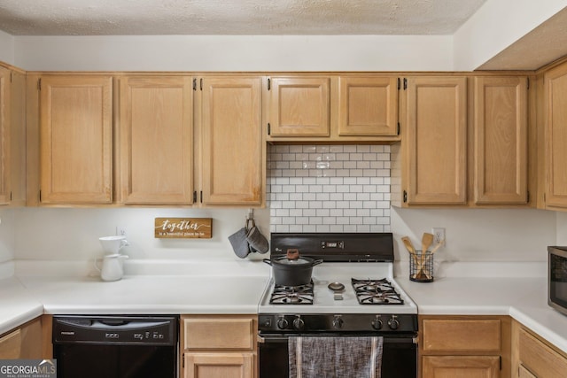 kitchen with tasteful backsplash, range with gas stovetop, light countertops, and black dishwasher