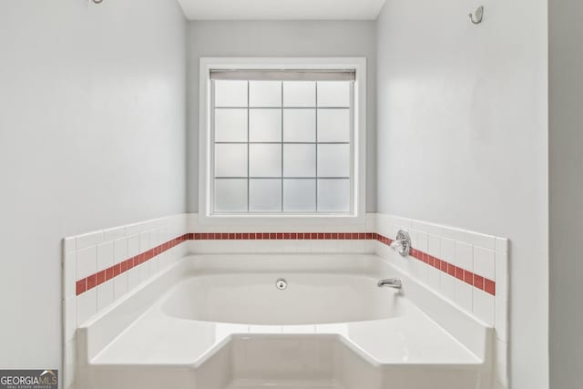 bathroom with a healthy amount of sunlight and a garden tub