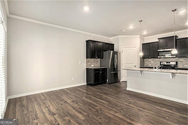 kitchen featuring a breakfast bar, dark wood finished floors, appliances with stainless steel finishes, baseboards, and light stone countertops