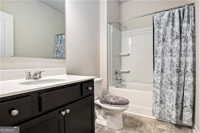 full bathroom with shower / bath combination with curtain, toilet, and vanity