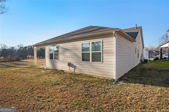 view of property exterior with a yard