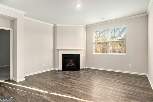 unfurnished living room featuring crown molding, a fireplace with flush hearth, wood finished floors, and baseboards