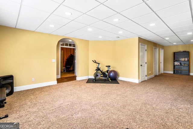 workout room with recessed lighting, baseboards, arched walkways, and carpet flooring