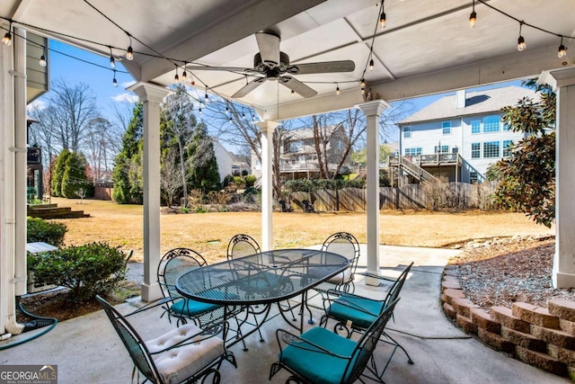 view of patio / terrace featuring outdoor dining space, a ceiling fan, and fence