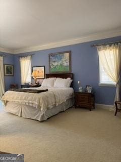 bedroom with light colored carpet, baseboards, and ornamental molding