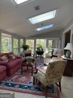 sunroom / solarium featuring a wealth of natural light, visible vents, and lofted ceiling with skylight