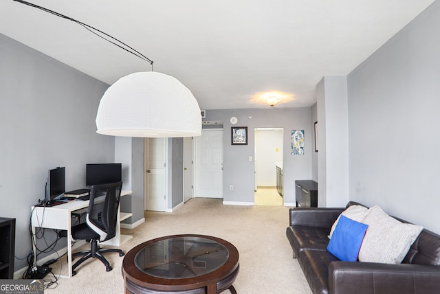 office featuring baseboards and carpet flooring