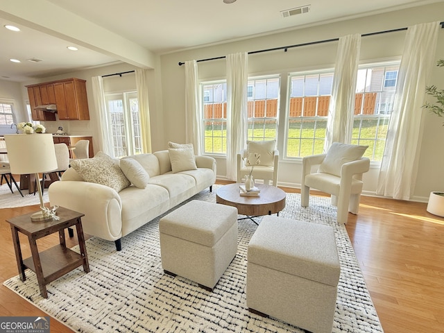 spare room featuring arched walkways, carpet flooring, a tray ceiling, and ornate columns