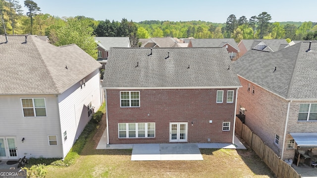 view of front of house featuring a garage, brick siding, and driveway